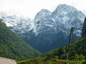 a view of a mountain range with snow covered mountains at Apartment Milan in Trenta