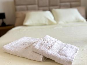 Postel nebo postele na pokoji v ubytování Maribelle Apartments
