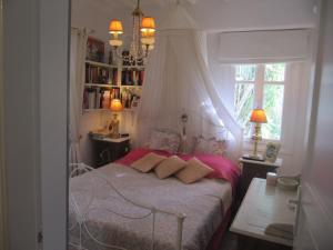 a bedroom with a bed and a book shelf at Diles Complex Apartment in Ornos