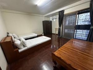 Un pat sau paturi într-o cameră la Cozy Townhouse near PSU, Hat Yai บ้านทั้งหลัง
