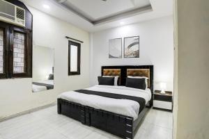 Postel nebo postele na pokoji v ubytování Hotel O Metro Residency