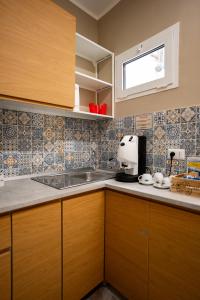 a kitchen with wooden cabinets and a sink at Experience Napoli Center in Naples