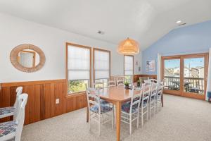 a dining room with a table and chairs at Weekend at Pinchys in Kill Devil Hills +33 photos