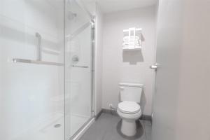 a bathroom with a toilet and a glass shower at Hampton Inn By Hilton Santa Clarita-Valencia in Santa Clarita +4 photos