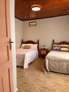 Postel nebo postele na pokoji v ubytování Vintage Haven Home + 3 fotografie