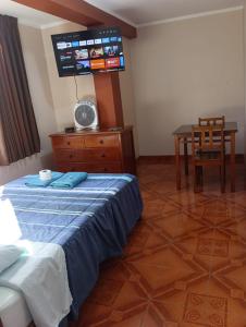 Giường trong phòng chung tại Casa Hospedaje Inkani