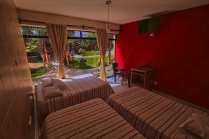 Postel nebo postele na pokoji v ubytování Hotel Rumi Wasi