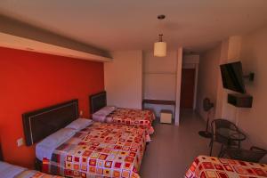 Postel nebo postele na pokoji v ubytování Hotel Rumi Wasi