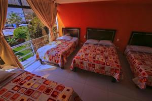 Postel nebo postele na pokoji v ubytování Hotel Rumi Wasi
