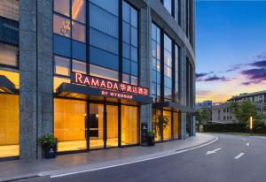 a building with a sign that reads rani majdar on it at Ramada by Wyndham Hangzhou Yuhang in Hangzhou