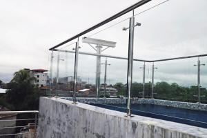a swimming pool on the roof of a building at Denis House in Iquitos