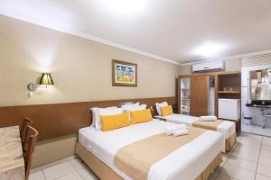 Postel nebo postele na pokoji v ubytování Amuarama Hotel