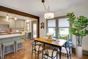 a kitchen and dining room with a table and chairs at Renovated Lubbock Home - Walk to Texas Tech! in Lubbock