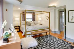a bedroom with a bed with a large mirror at Renovated Lubbock Home - Walk to Texas Tech! in Lubbock