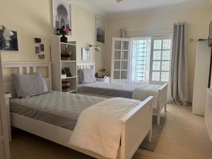Postel nebo postele na pokoji v ubytování Villa luxueuse à Skhirat Rabat
