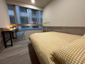 Postel nebo postele na pokoji v ubytování Formosa 101 Taipei Main Branch