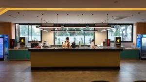 a restaurant with a large counter with two people standing at it at PALEMON Resort& Spa in Manavgat +84 photos