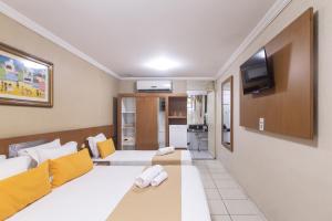 TV a/nebo společenská místnost v ubytování Amuarama Hotel