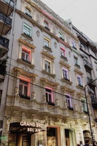 a large building with colorful windows on a city street at Grand Brizo Bel Air in Buenos Aires
