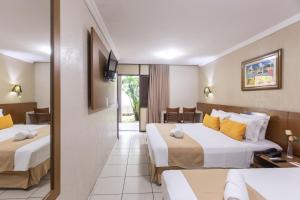 Postel nebo postele na pokoji v ubytování Amuarama Hotel