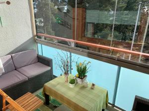 a living room with a couch and a table at Familyfriendly, charming apartment 3 km to centre in Porvoo