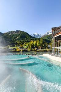 a body of water with mountains in the background at NEW - Jardin - Proche Briançon Serre Che - Vue montagne - Ski in Villar-Saint-Pancrace