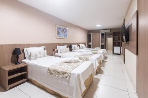Postel nebo postele na pokoji v ubytování Amuarama Hotel