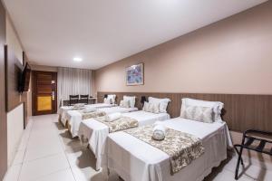Postel nebo postele na pokoji v ubytování Amuarama Hotel