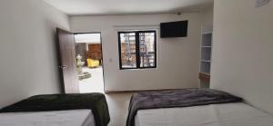 Voodi või voodid majutusasutuse Hotel Fuente Real Popayán toas