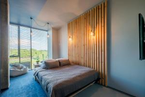 Cama ou camas em um quarto em Urbihop Hotel