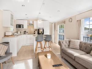 a living room with a couch and a table at European Lodge - Uk40848 in Scarborough
