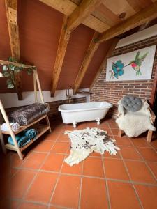 a bathroom with a bath tub and a sink at Cabañas el lago in Zacatlán +44 photos