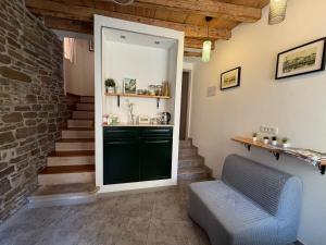 a living room with a green door and stairs at Lighthouse.Izola in Izola