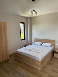 a bedroom with a large bed in a room at Mirza Guesthouse in Batumi