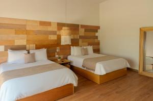 Letto o letti in una camera di Mayan Monkey Cancun - Social Hotel