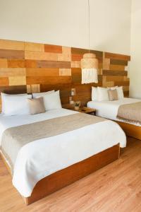 Letto o letti in una camera di Mayan Monkey Cancun - Social Hotel