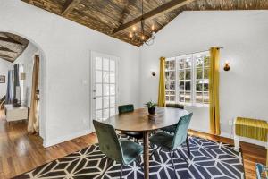 a dining room with a table and chairs at 3br 1bath - Spanish Beach Bungalow MainHouse in Daytona Beach +34 photos
