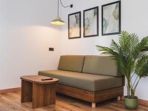 a living room with a couch and a table at Vago Ibiza in San Antonio Bay