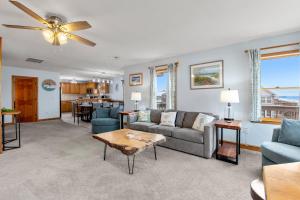 a living room with a couch and a table at The Lily Pad in Nags Head