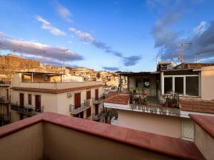 a view of a city from the balcony of a building at Casa Vacanza Acquanuova in Calatafimi