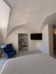 TV a/nebo společenská místnost v ubytování Suite Garden- Palazzo Villani Lubelli