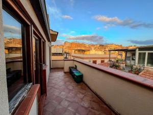 an apartment balcony with a view of a city at Casa Vacanza Acquanuova in Calatafimi +54 photos