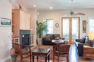 a living room with a couch and a fireplace at Reminiscent in Nags Head