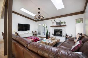 a living room with a brown leather couch at 2633 Kinnickinnick Rd., Unit E2 in Vail