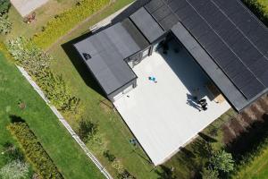 an overhead view of a house with a swimming pool at Blackrock in Varberg