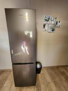 een roestvrijstalen koelkast in de hoek van een kamer bij Ode to Tranquility House - Pax 6 in Pretoria