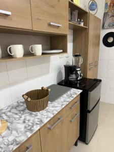 a kitchen with a stove and a counter top at aparta estudio susheria in Sincelejo +1 photo