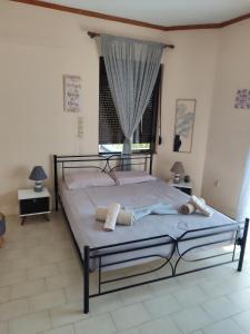 Postel nebo postele na pokoji v ubytování The Green Garden in AGIA VASSA