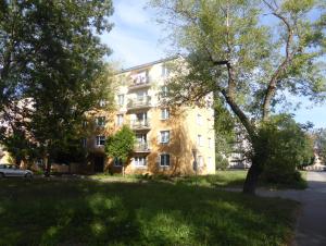 an apartment building on the side of the street at Retro Apartment in Brezno