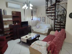 Posezení v ubytování The Green Garden in AGIA VASSA